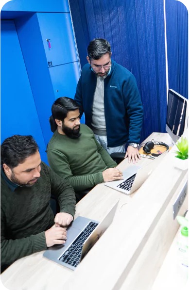 Three of the team reviewing a page together