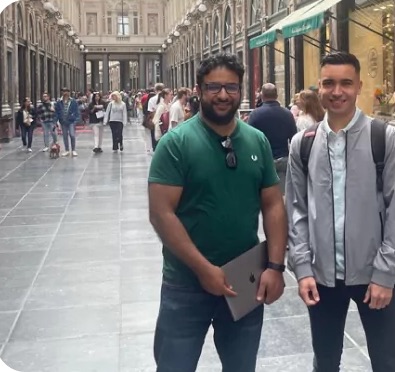 Two of the team meeting a client abroad