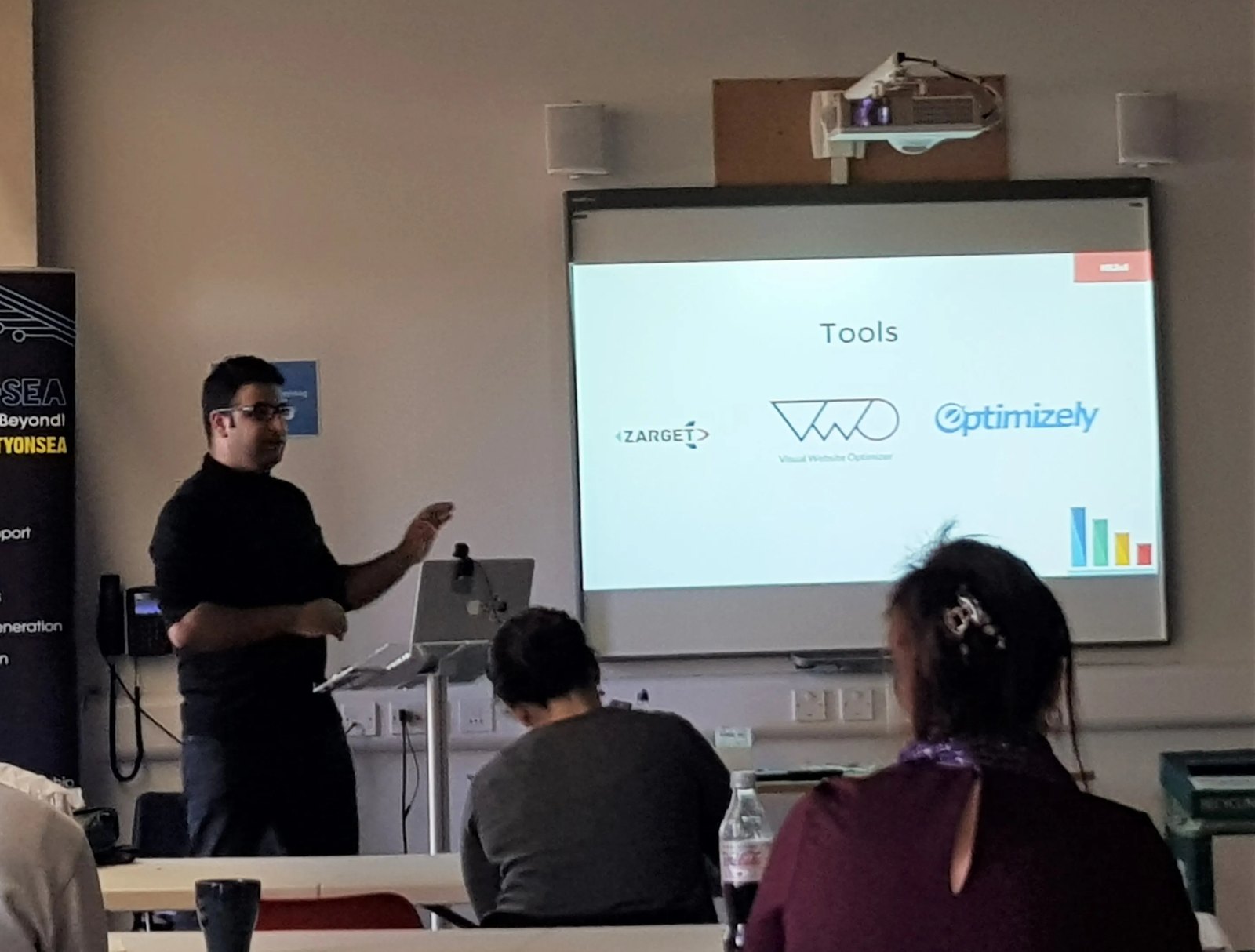 Waseem presenting at an industry event